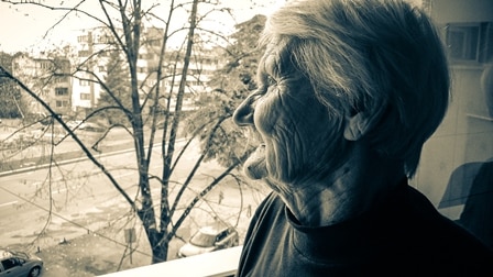Older woman at her window